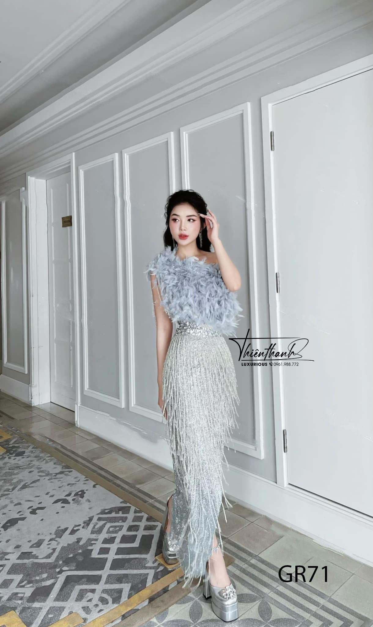 Đầm TK Dài Xoè Tua Rua Lệch Vai Lông Vũ