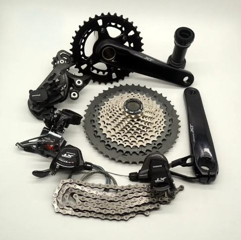 BỘ GROUPSET SHIMANO DEORE M8000 (2*12 SPEED, GIÒ DĨA, TAY BẤM, CÙI ĐỀ, SÊN , LÍP)