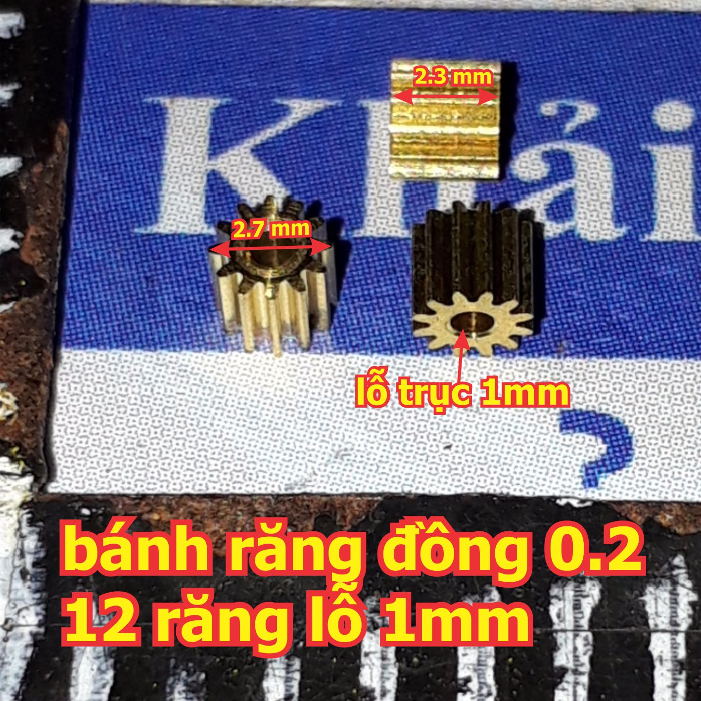 bánh răng đồng 0.2 đầu trục 12 răng lỗ 1mm phi 2.7mm cao 2.3mm kde0144