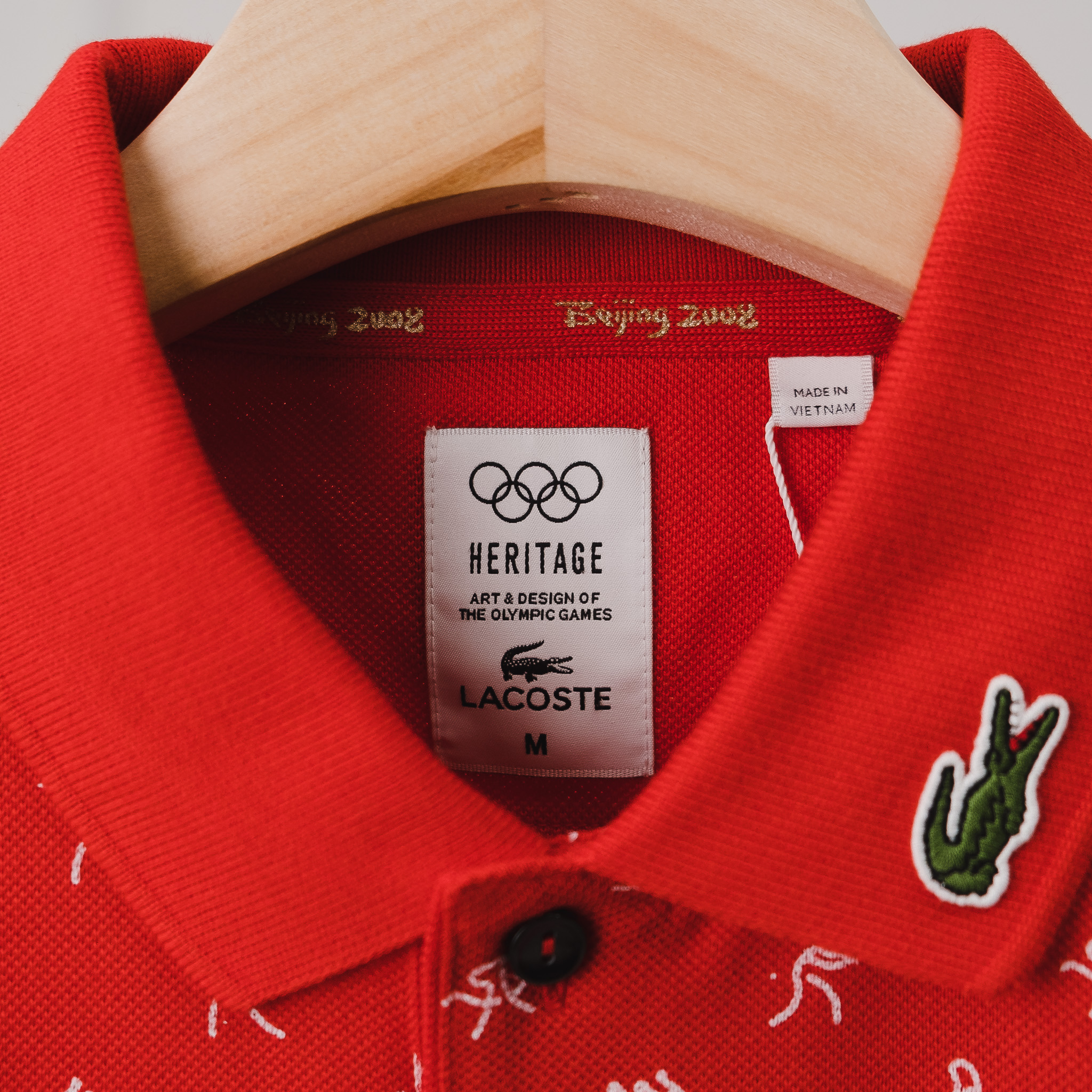 Áo Polo LACOSTE Đỏ hoạ tiết trắng, logo cổ trái