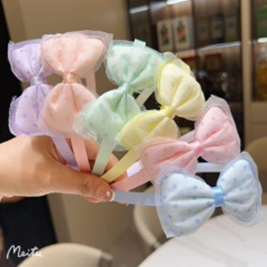Bờm tóc hình nơ chấm bi.