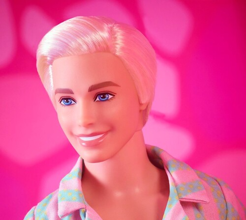 Mattel - Barbie The Movie Ken Doll Wearing Pastel Striped Beach Matching Set with Surfboard (Large Item, Doll)