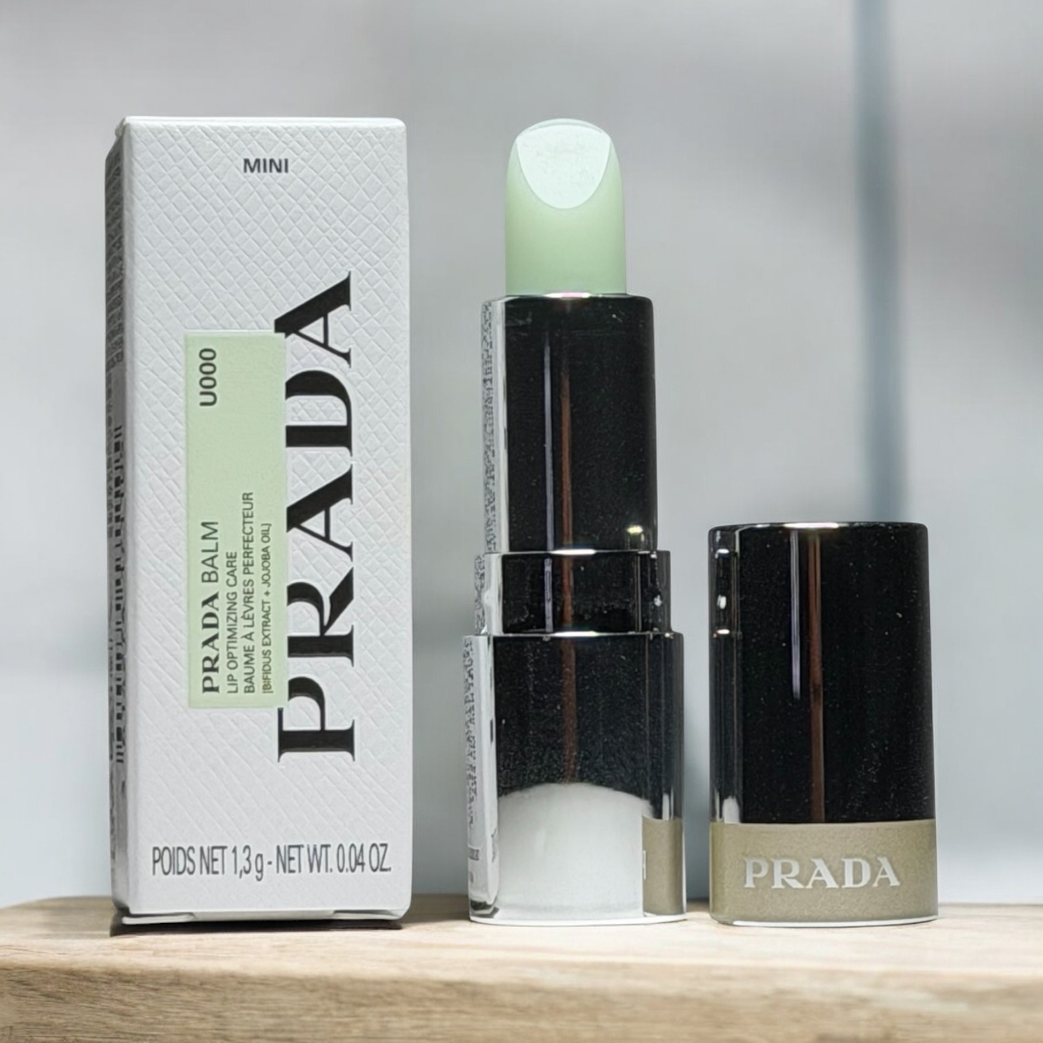 [Mini 1.3g] Son Dưỡng Prada Balm Lip Optimizing Care U000 Universal
