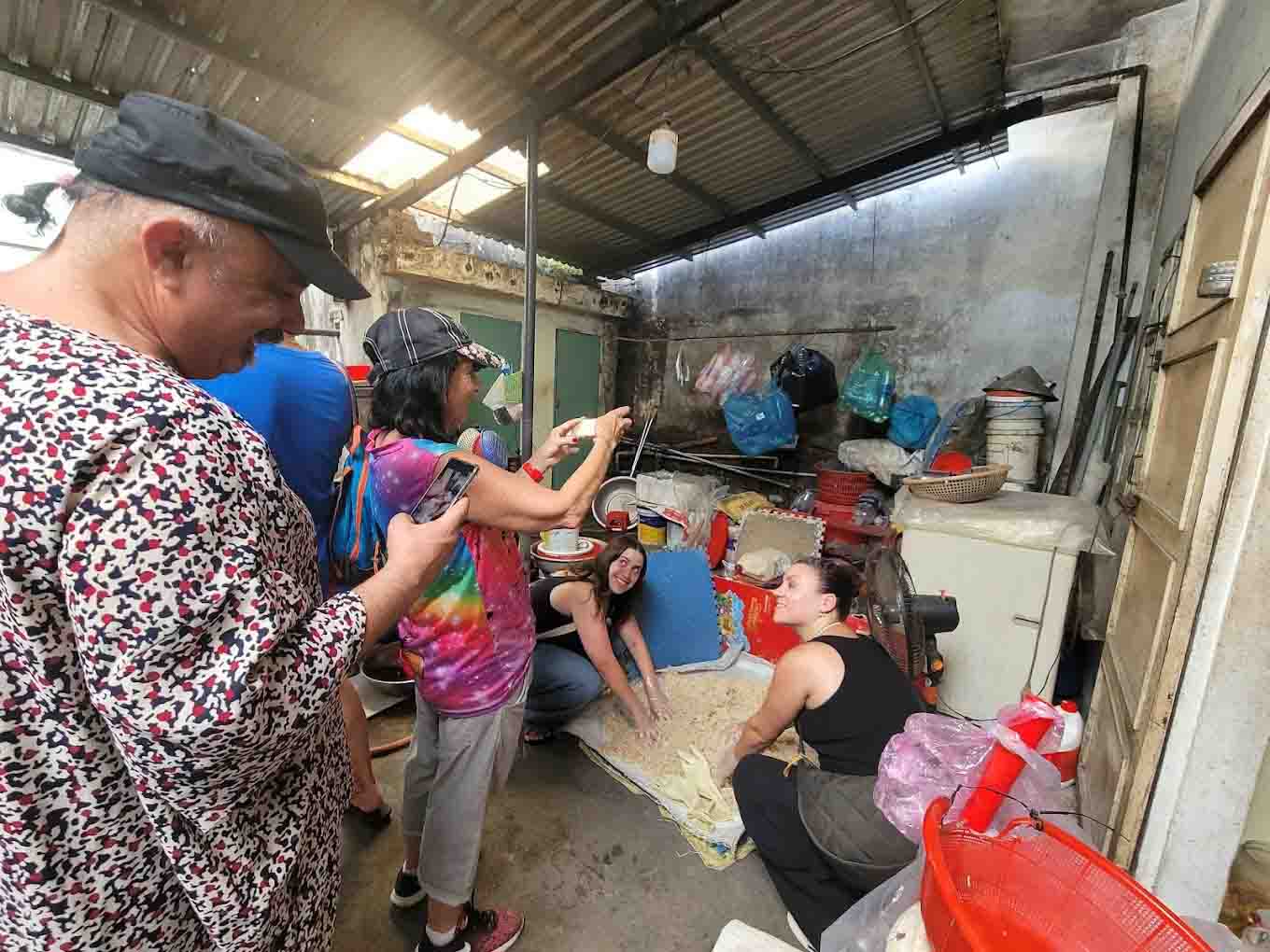 Tourists experience making traditional rice wine in Hoi An 