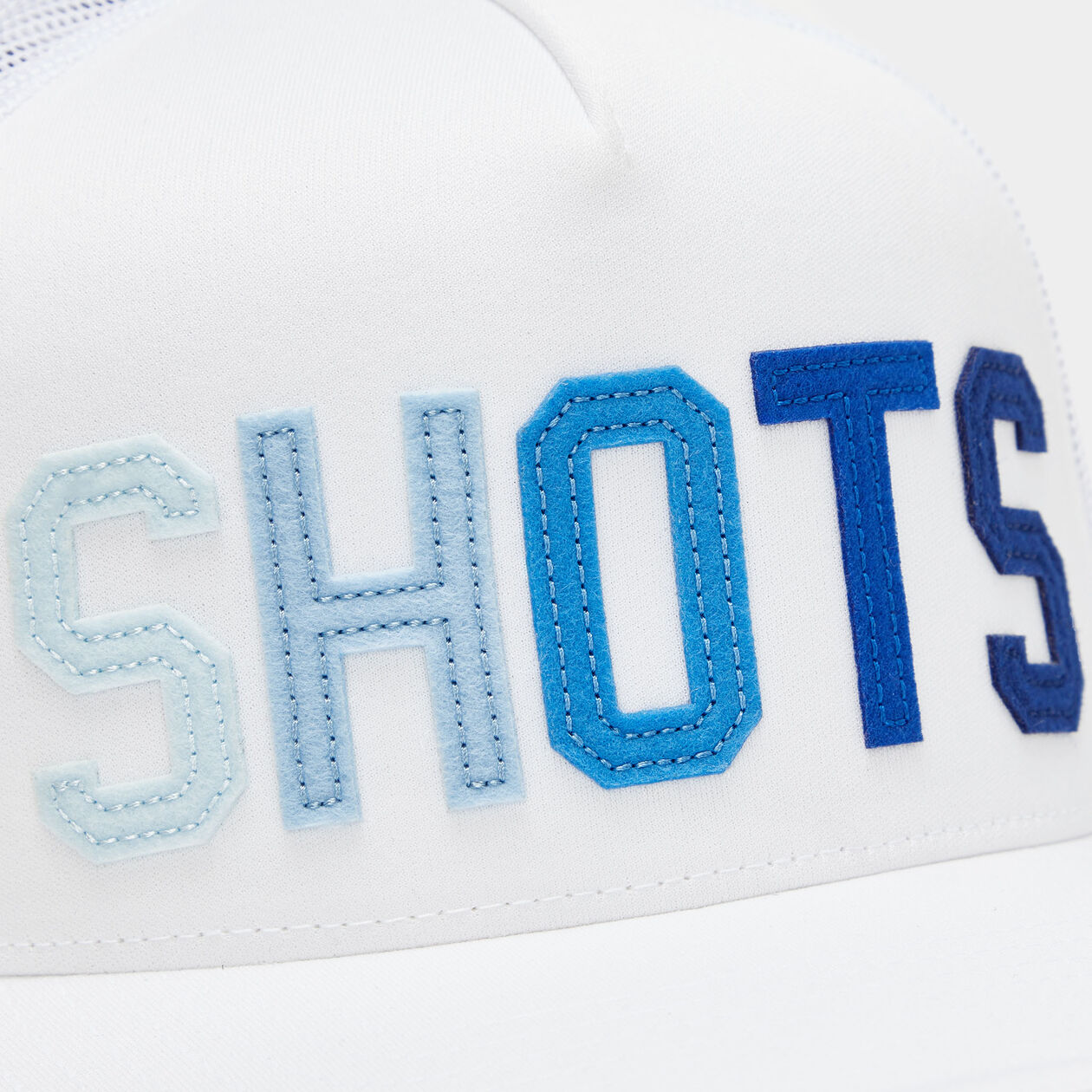 NÓN SHOTS TIPPED BRIM INTERLOCK KNIT TRUCKER