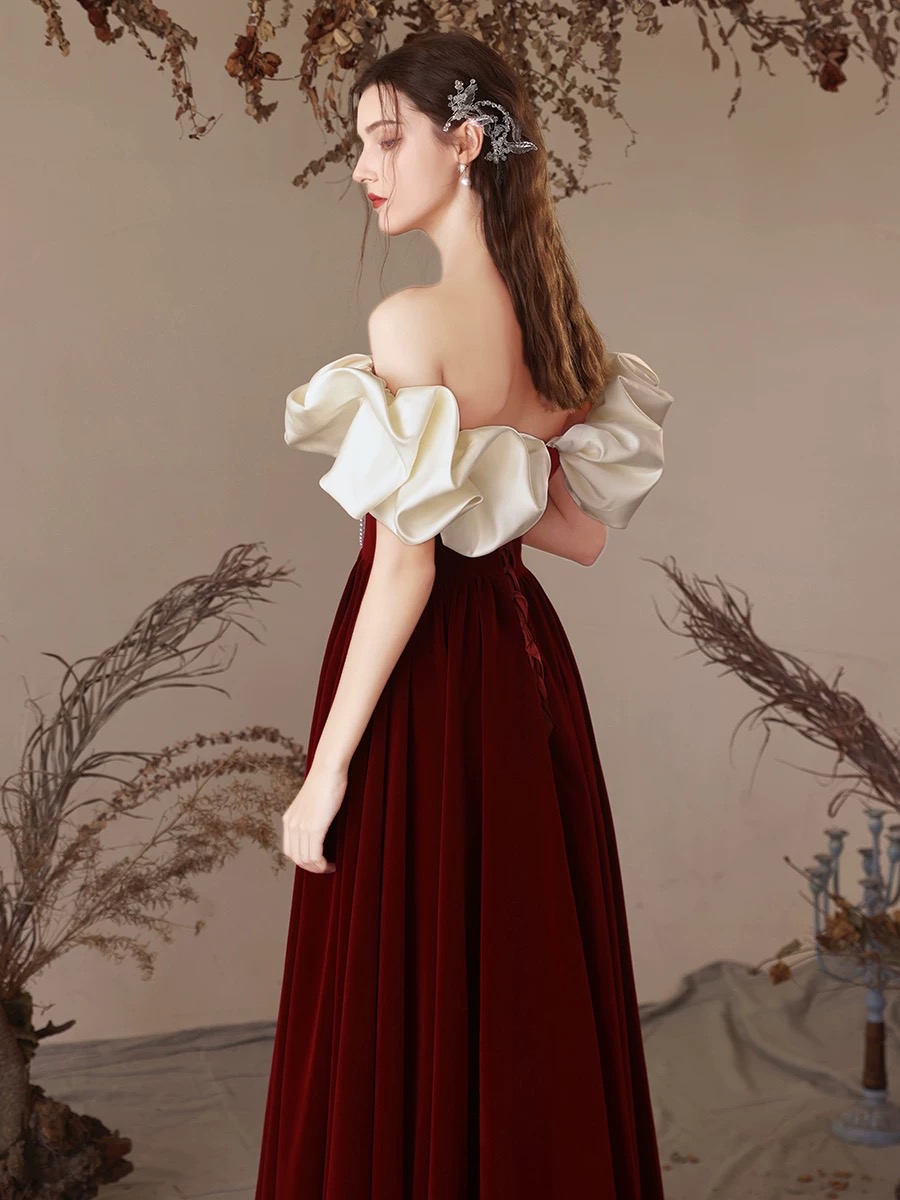 Red velvet one-shoulder dress for brides, weddings, and engagement ceremonies — a simple yet elegant pearl wedding gown. R4000