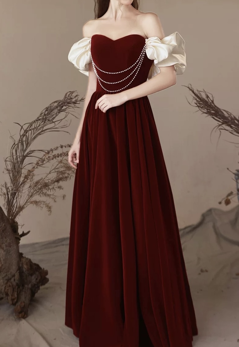 Red velvet one-shoulder dress for brides, weddings, and engagement ceremonies — a simple yet elegant pearl wedding gown. R4000