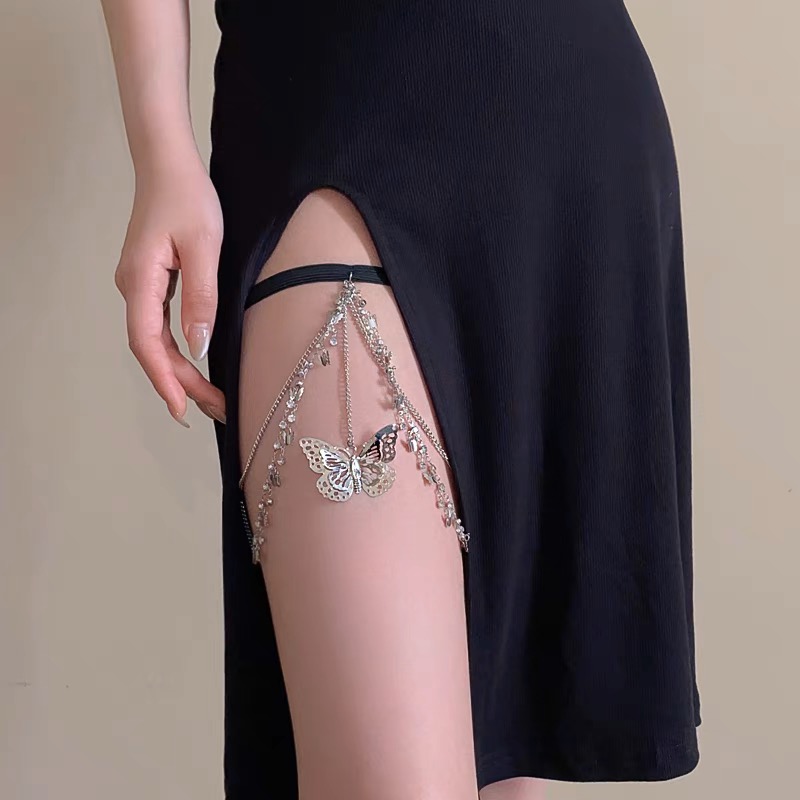 Butterfly necklace worn on thigh