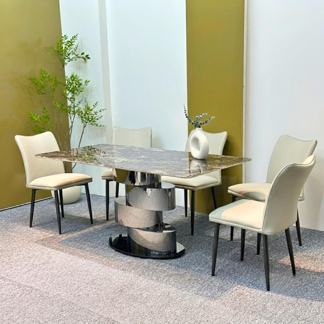 Bàn ăn Stella mặt đá thạch anh vi tinh thể xuyên sáng với chân inox xoắn nghệ thuật.