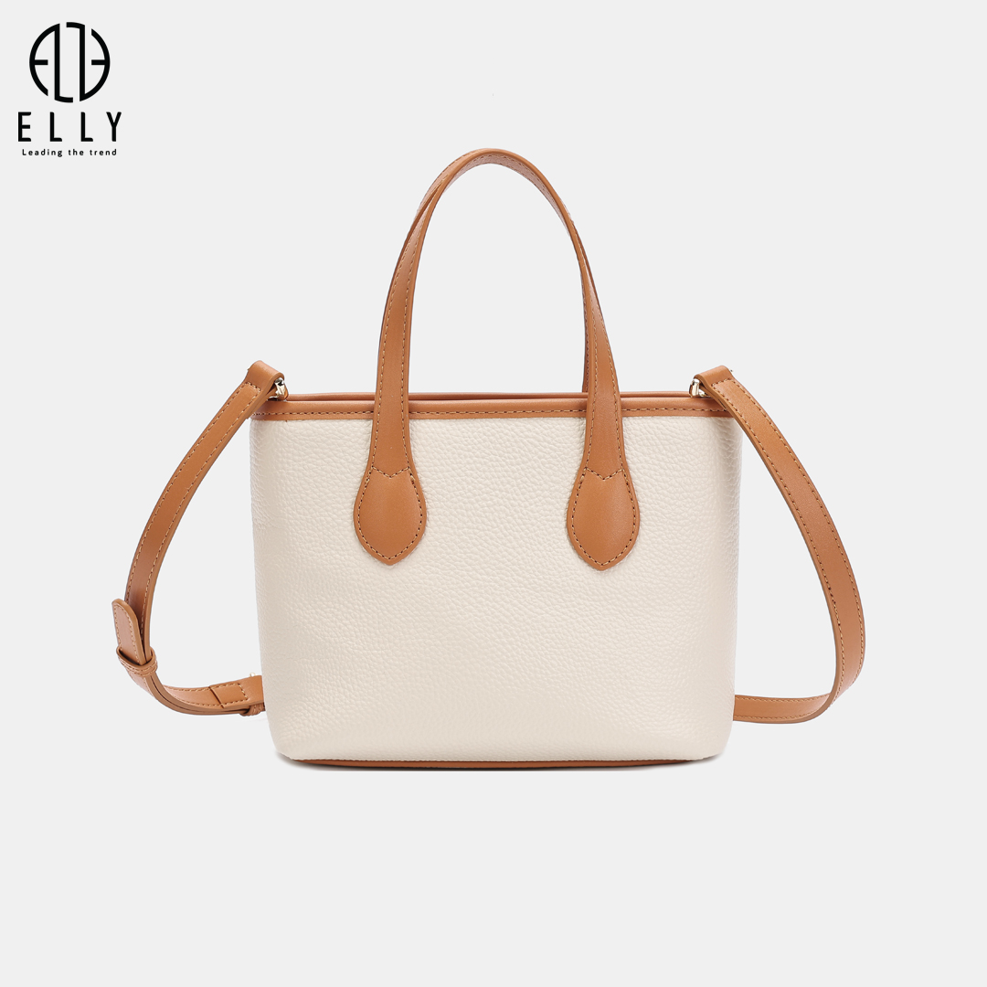 Form vuông nhỏ gọn nhưng chứa đồ tốt, tay cầm đôi chắc chắn kết hợp dây đeo dài linh hoạt, phù hợp cả đi làm lẫn đi chơi.