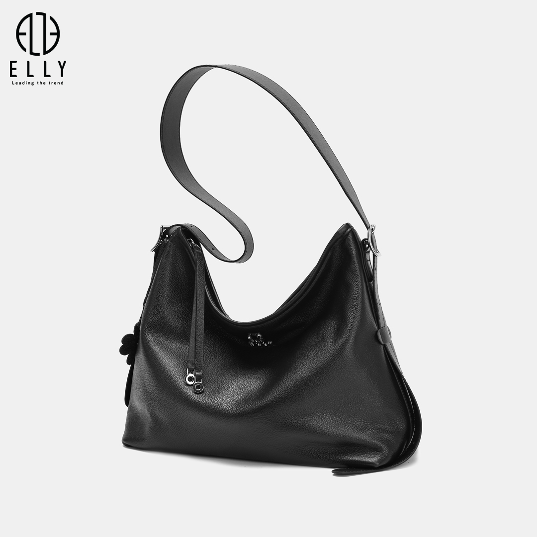 Túi sử dụng chất liệu da thật bề mặt trơn mịn, mềm tay, giữ form tốt và dễ phối đồ.