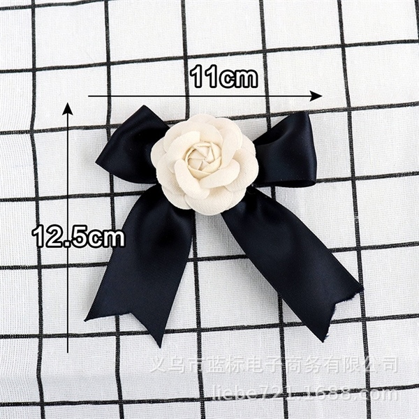 Trang trí nơ vải đen + hoa trà (11*12.5cm)