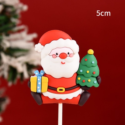 Trang trí silicon GS ông già Noel 1 tay cầm quà 1 tay cầm cây thông (CC)