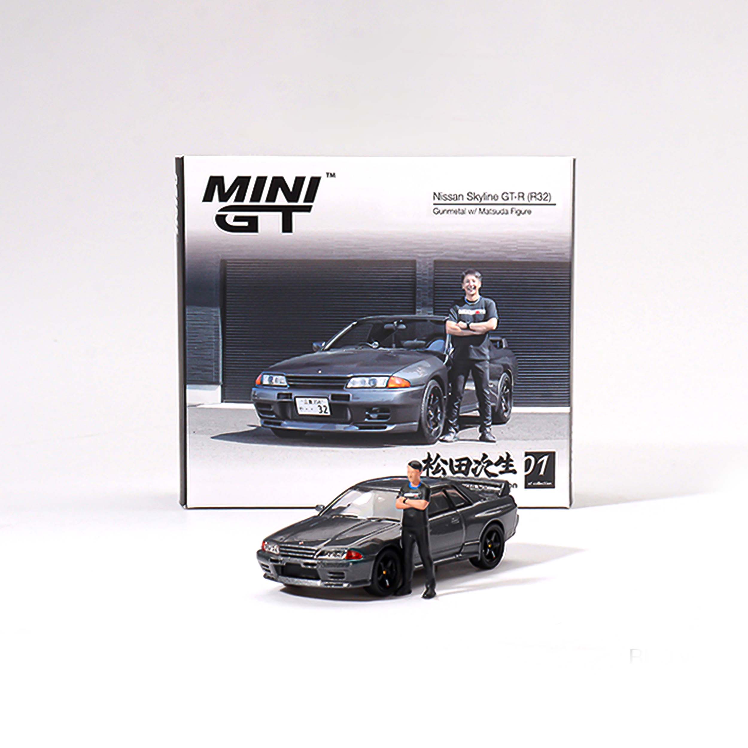 Mini GT Box Version MGT00869 Nissan Skyline GT-R (R32) Nismo Gunmetal W/ Matsuda Figure Tsugio Matsuda Collection