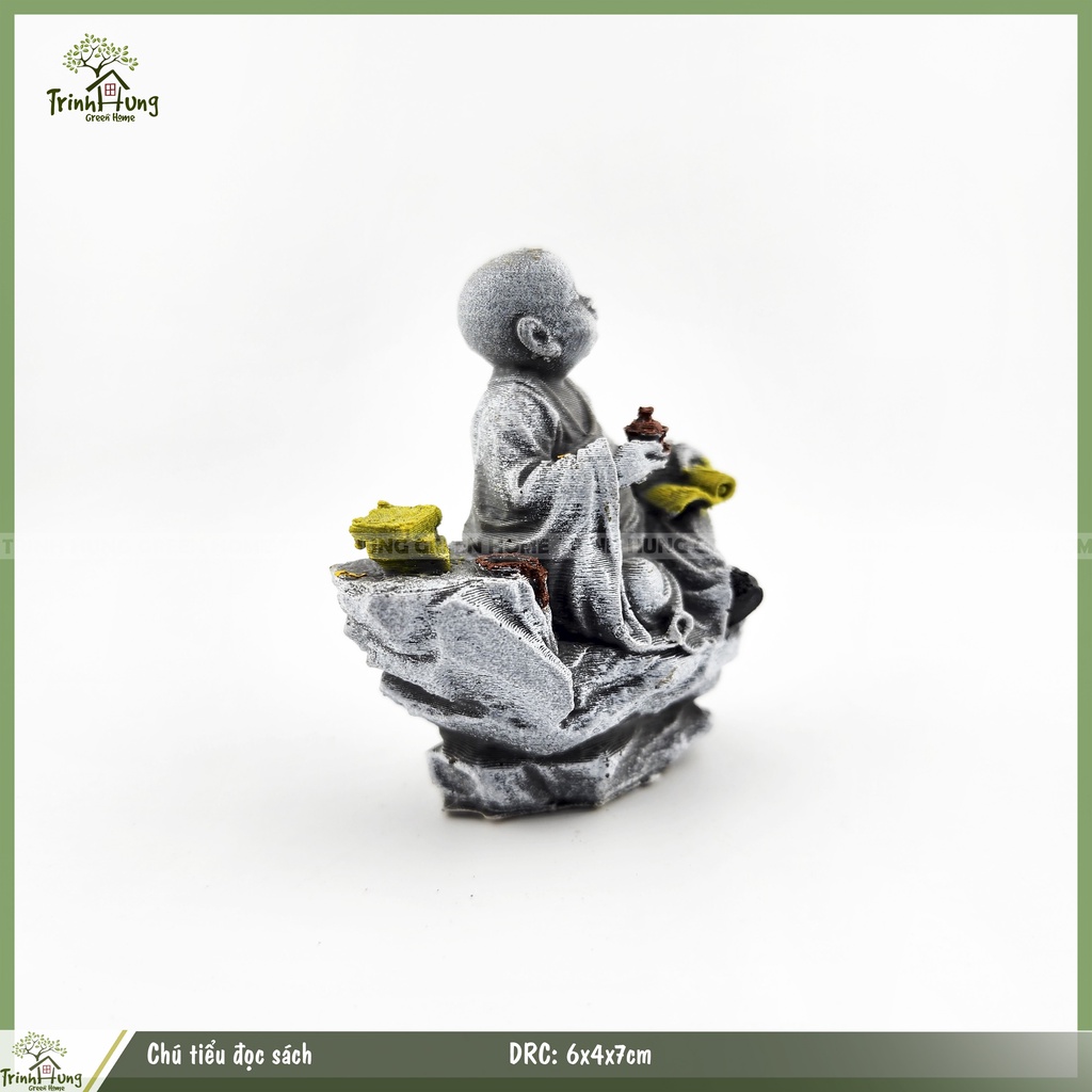 Tượng chú tiểu đọc sách