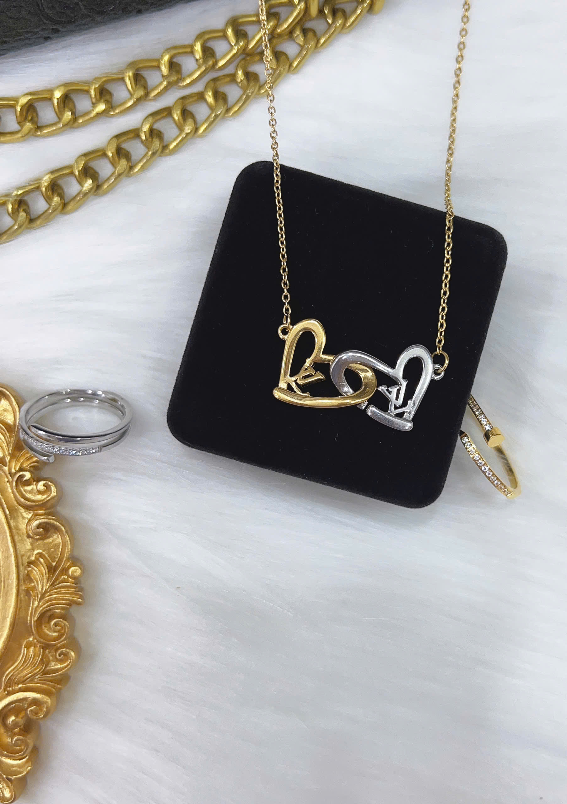 Dây chuyền Titan - TM043 - Trái tim LV cách điệu