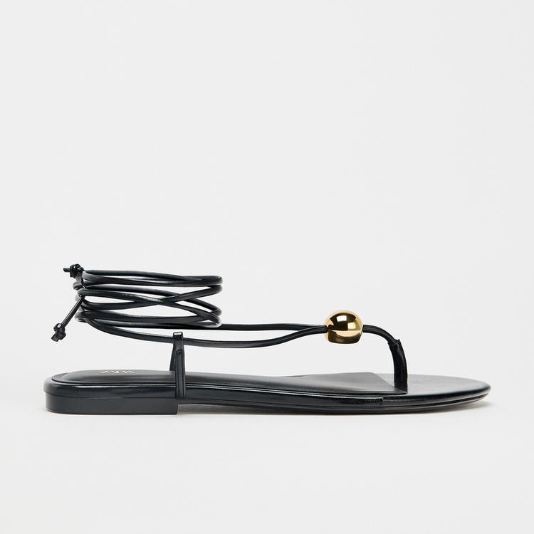 FLAT SANDALS WITH METALLIC APPLIQUÉ