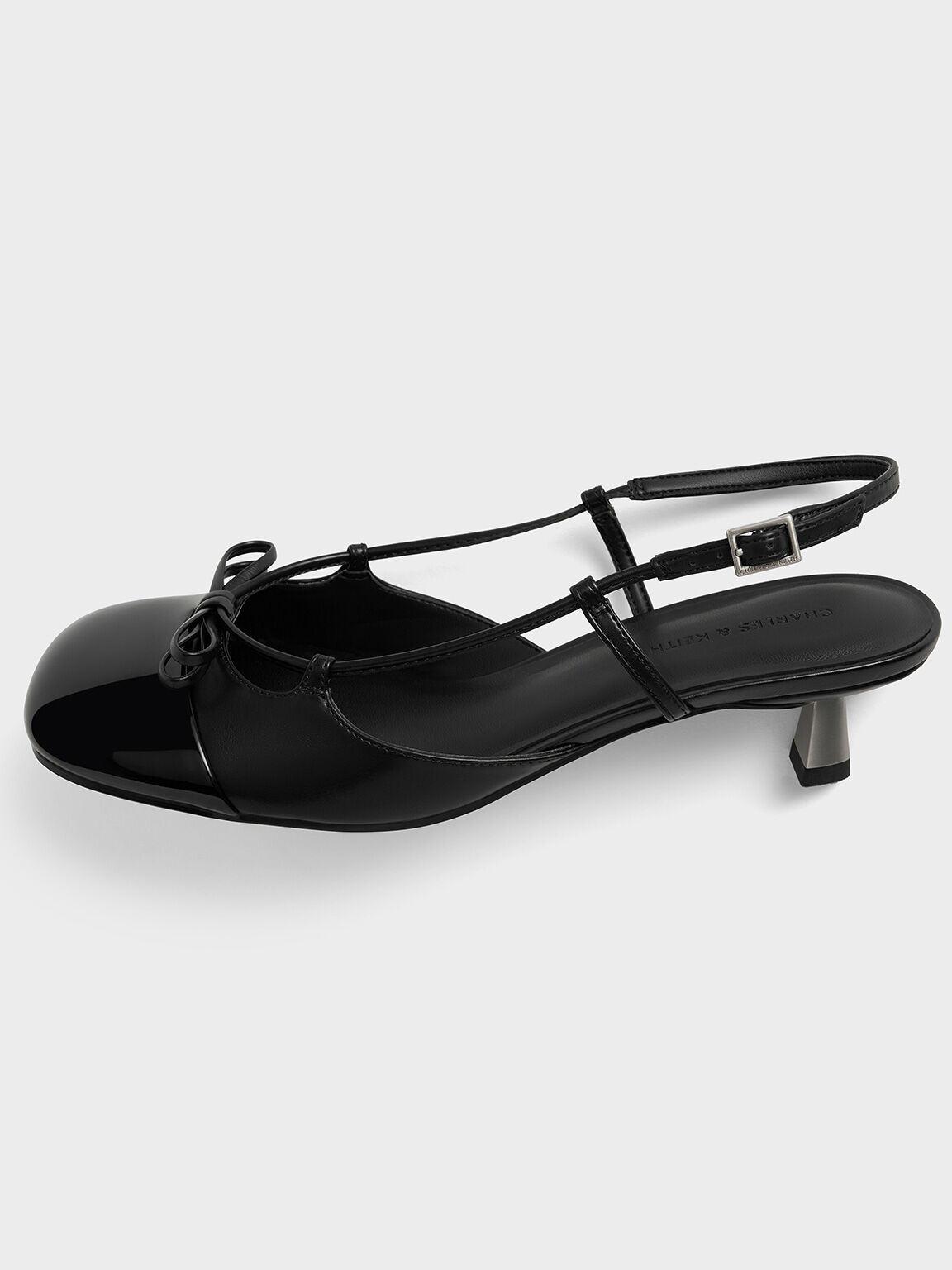 Patent Cap-Toe Bow Slingback Pumps