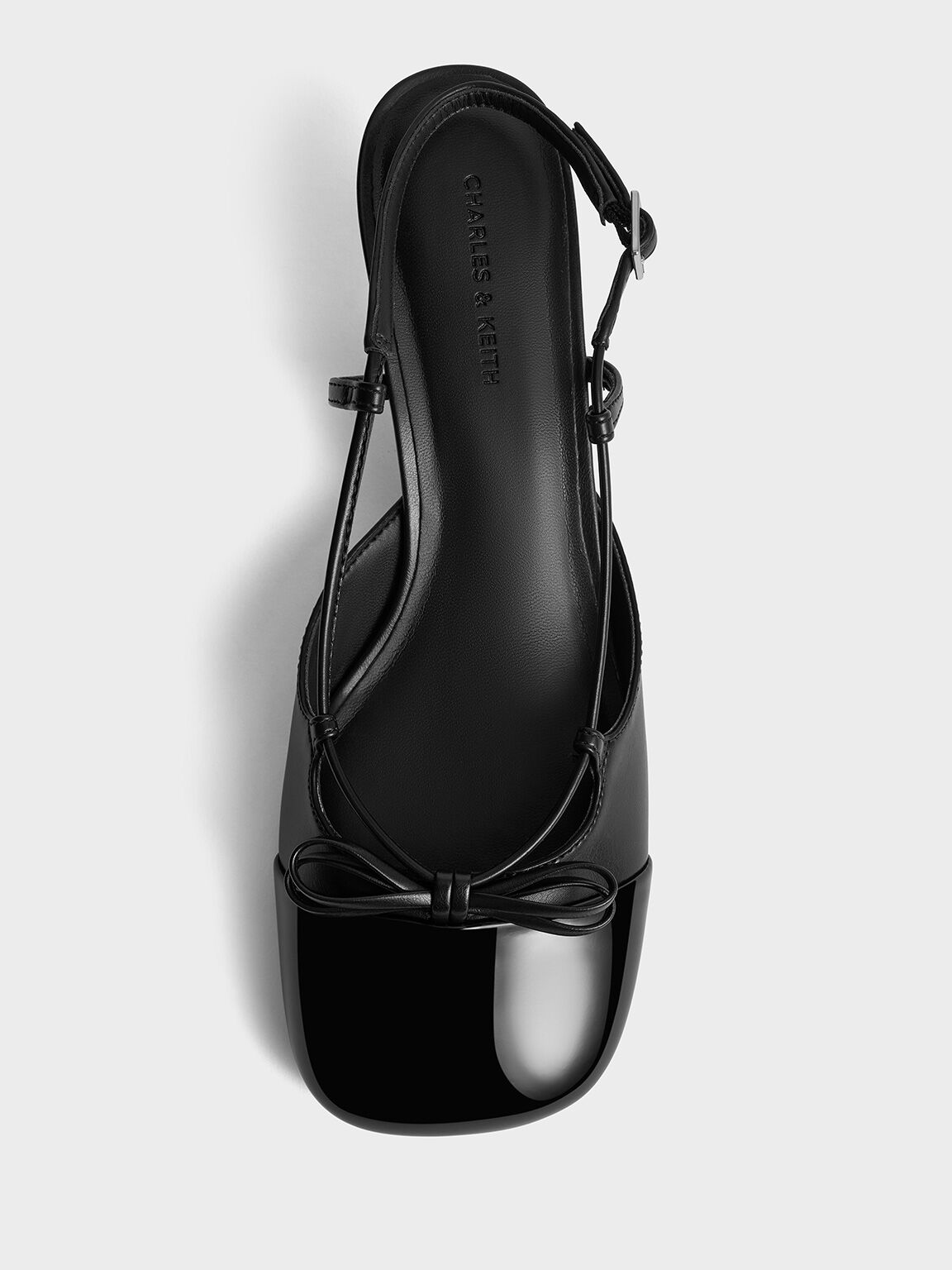 Patent Cap-Toe Bow Slingback Pumps