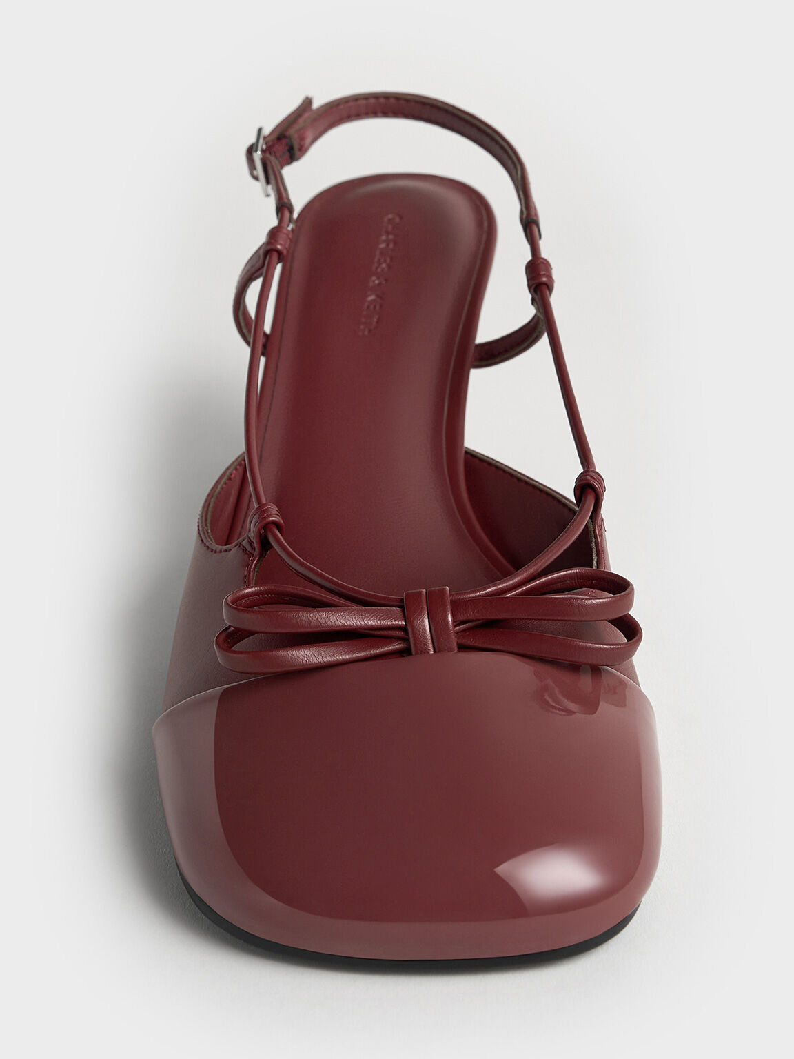 Patent Cap-Toe Bow Slingback Pumps