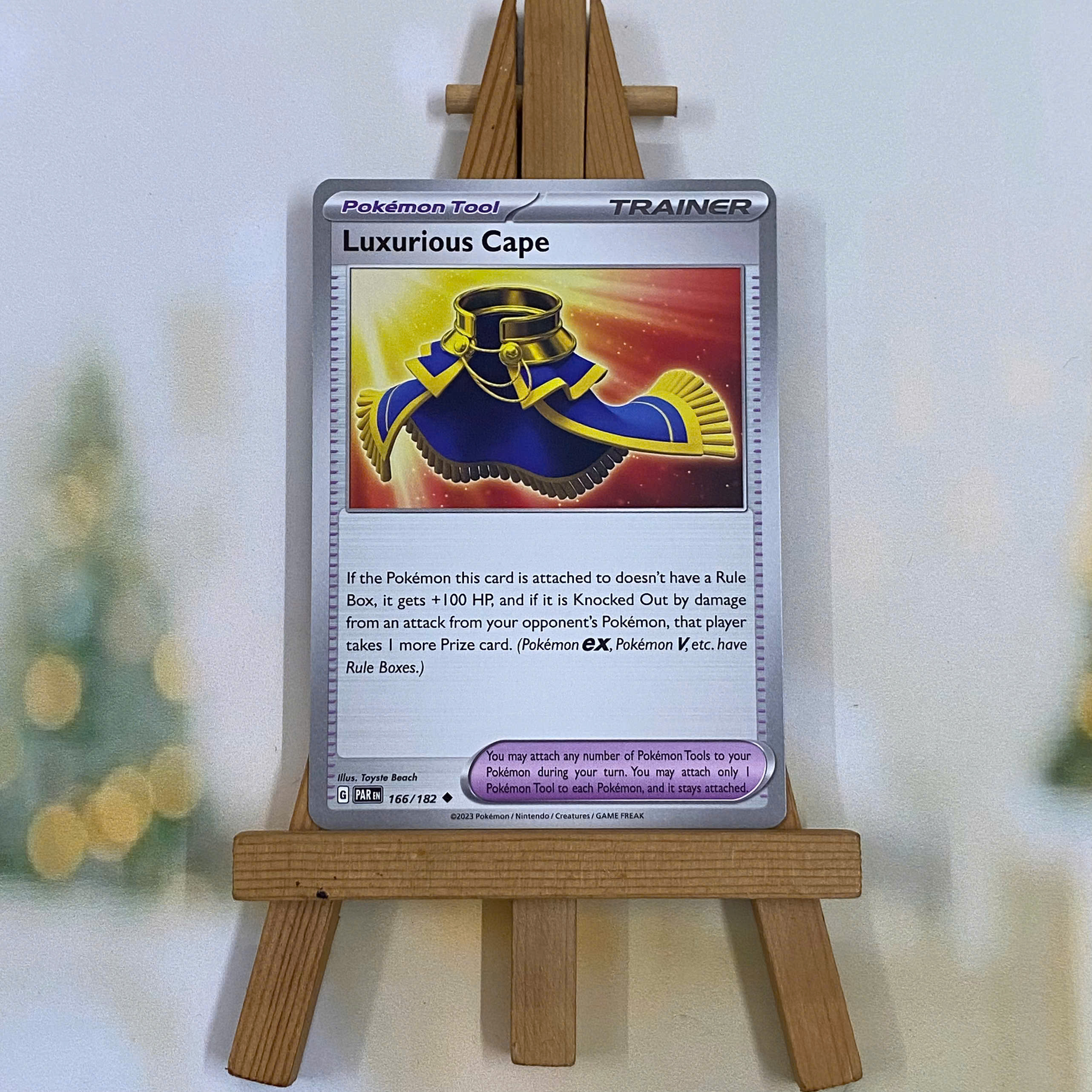 Thẻ hình Pokemon Luxurious Cape 166/182 - Lá bài lẻ Paradox Rift Uncommon Reverse Holo tiếng Anh