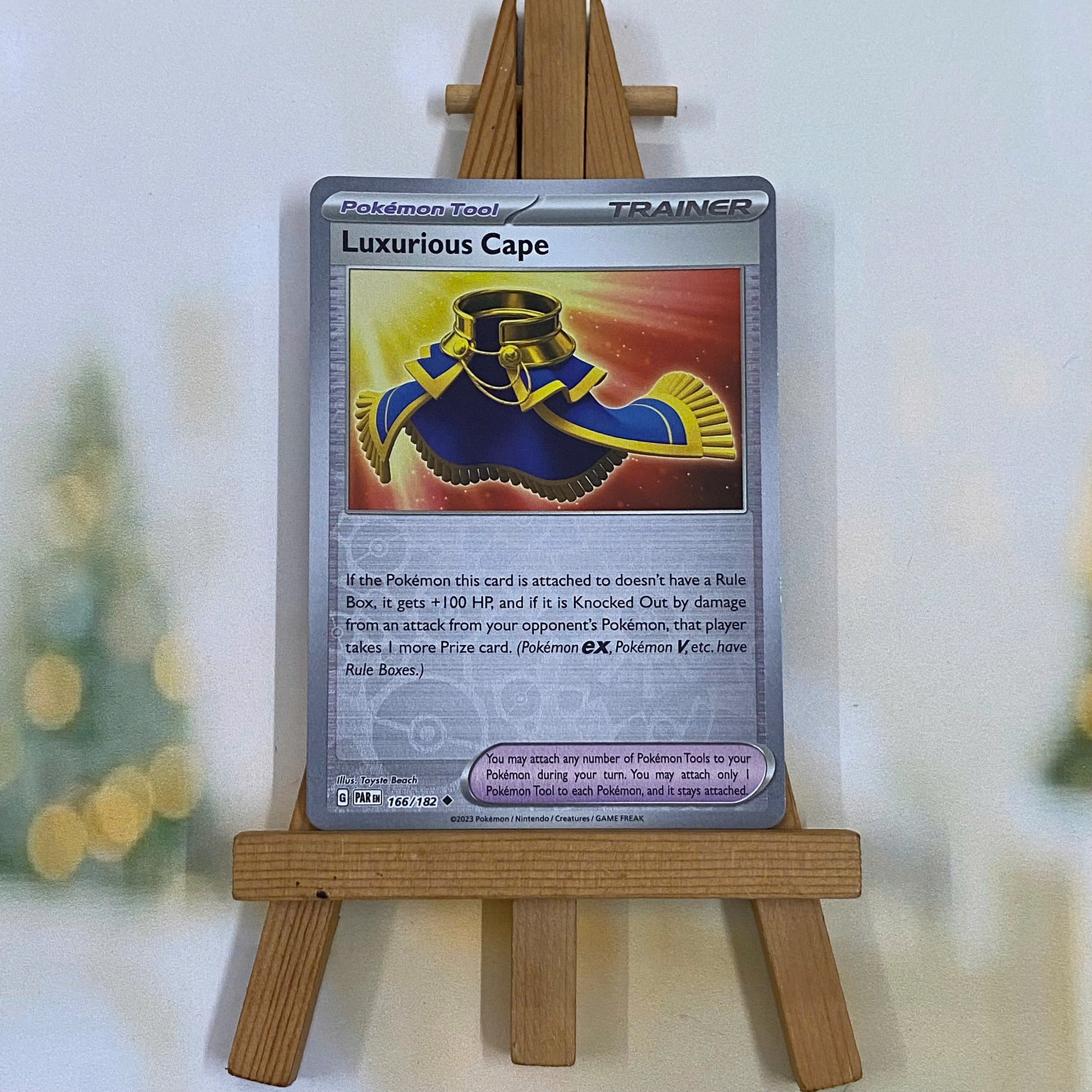 Thẻ hình Pokemon Luxurious Cape 166/182 - Lá bài lẻ Paradox Rift Uncommon Reverse Holo tiếng Anh