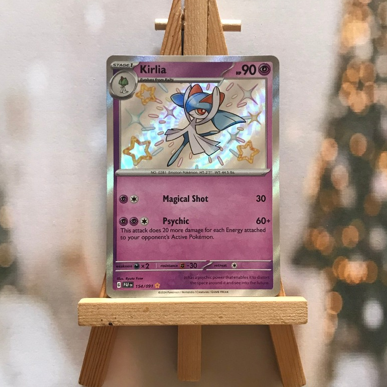 Thẻ hình Pokemon Kirlia 154/091- Bài lẻ Paldean Fates Shiny Rare tiếng Anh chính hãng