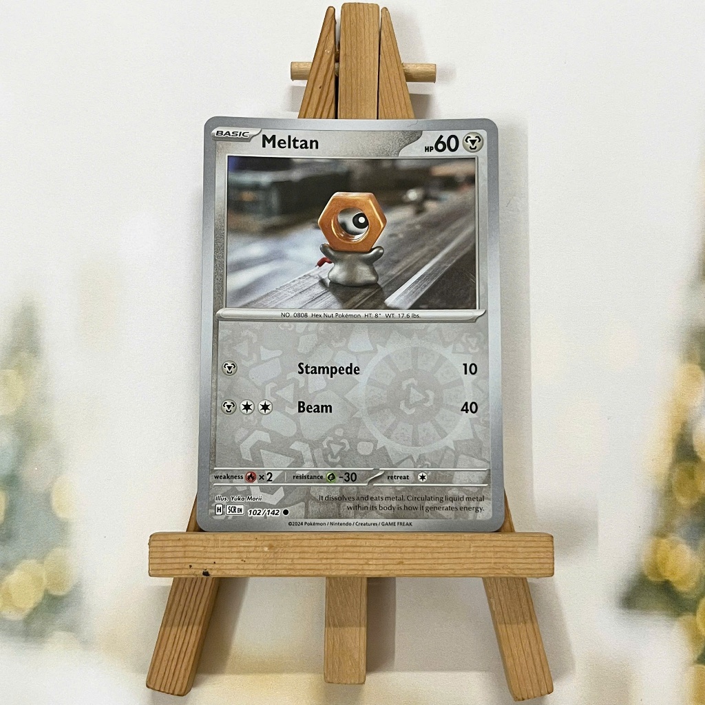 Thẻ hình Pokemon Meltan 102/142 - Lá bài lẻ Stellar Crown Common Reverse Holo tiếng Anh chính hãng
