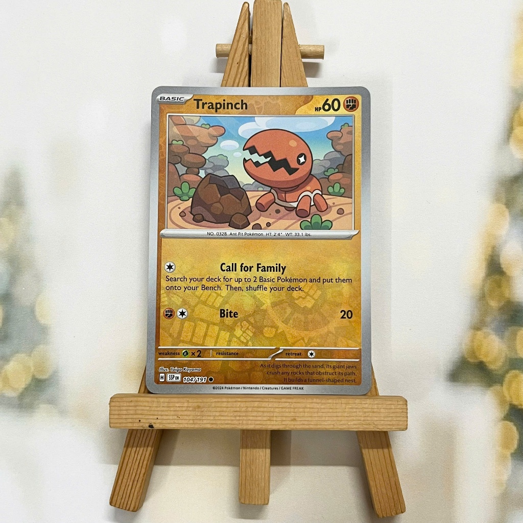 Thẻ hình Pokemon Trapinch 104/191 - Lá bài lẻ Surging Sparks Common Reverse Holo tiếng Anh chính hãng