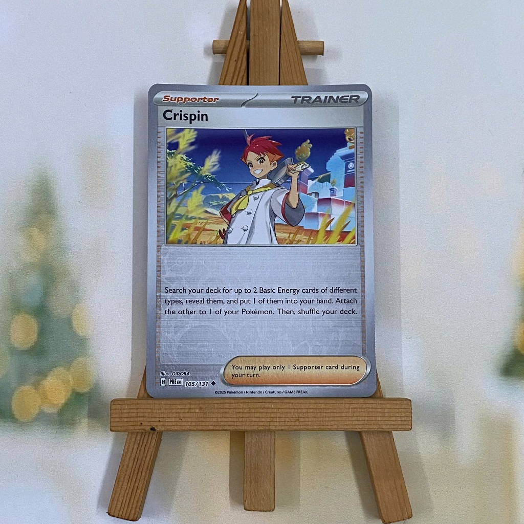 Thẻ hình Pokemon Crispin 105/131 - Lá bài lẻ Prismatic Evolutions Uncommon Reverse Holo tiếng Anh chính hãng