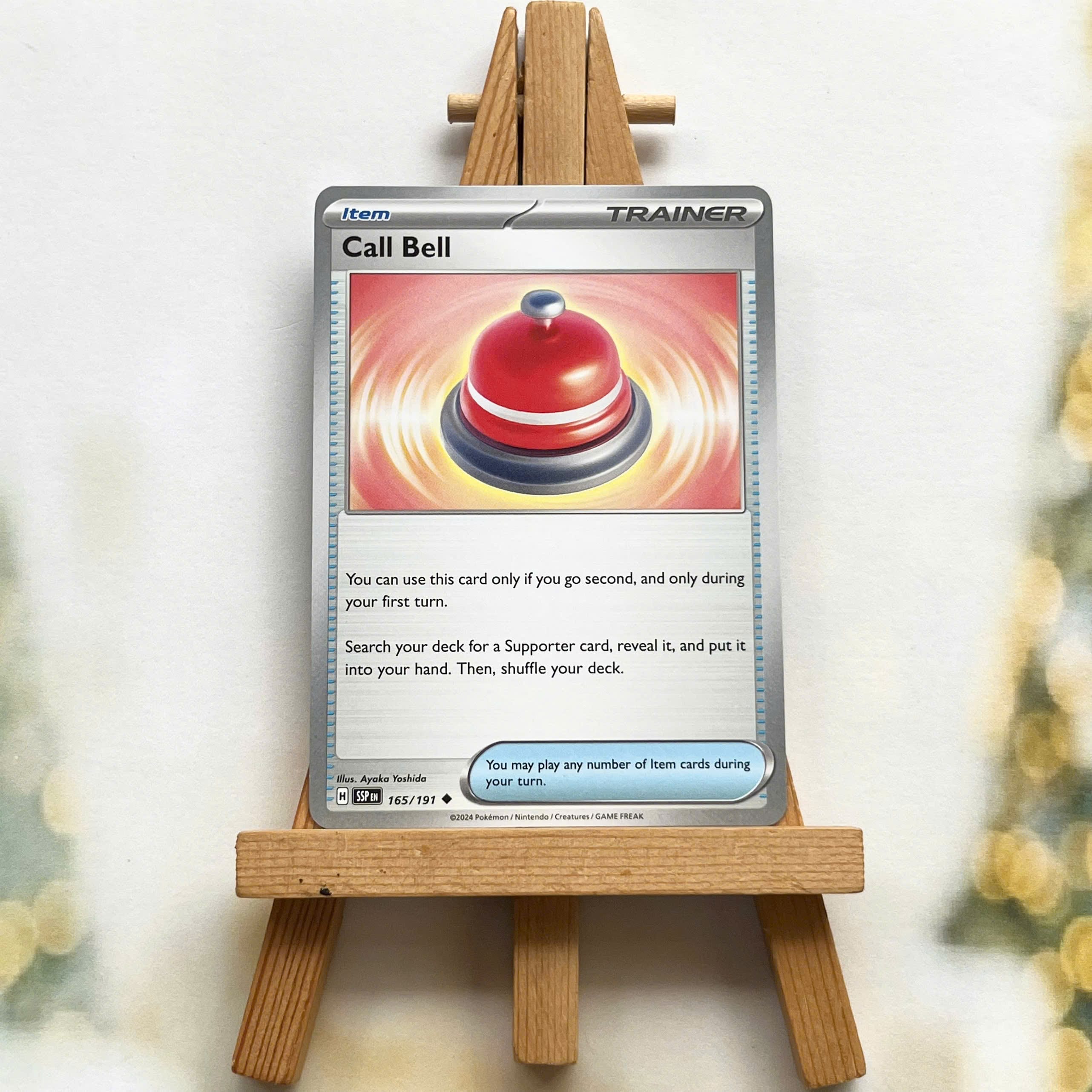 Thẻ hình Pokemon Call Bell 165/191 - Lá bài lẻ Surging Sparks Uncommon Reverse Holo tiếng Anh chính hãng
