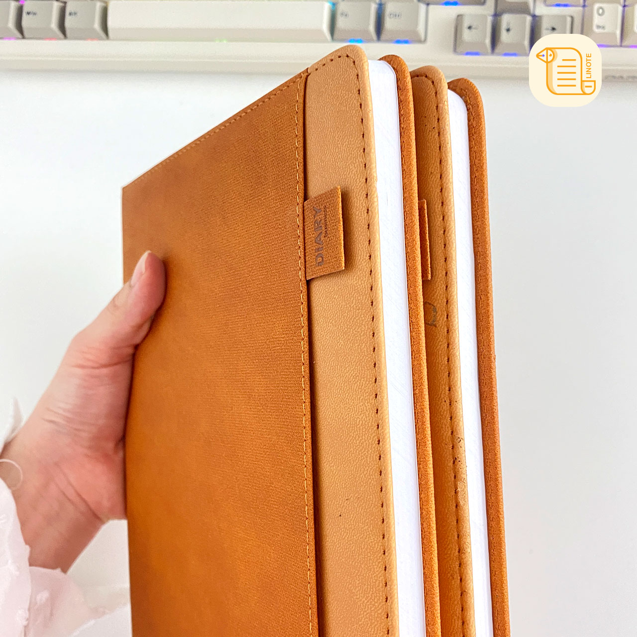 Sổ tay B5 kẻ ngang bìa da vân vải 70gsm, 200 trang, cài bút, để thẻ