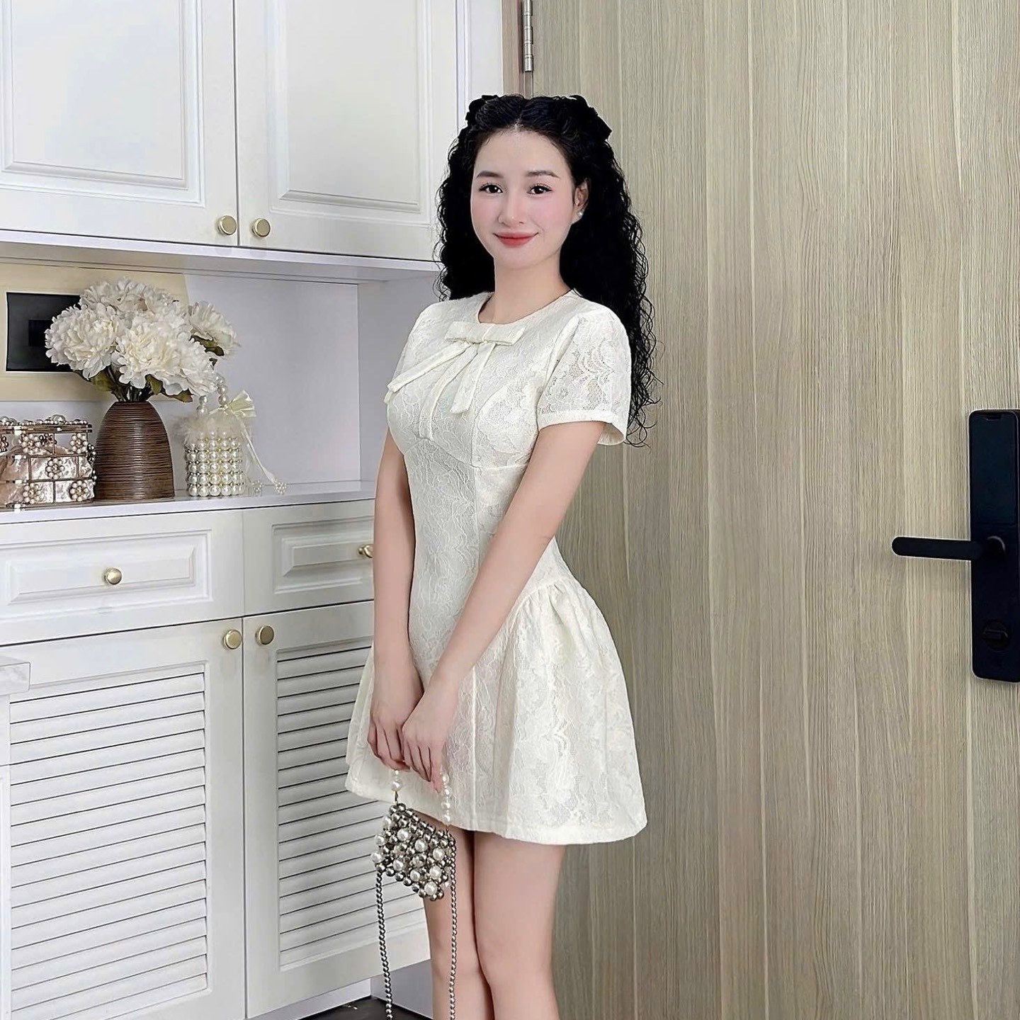 Đầm thiết kế cổ tròn nơ dáng A xoè ngắn