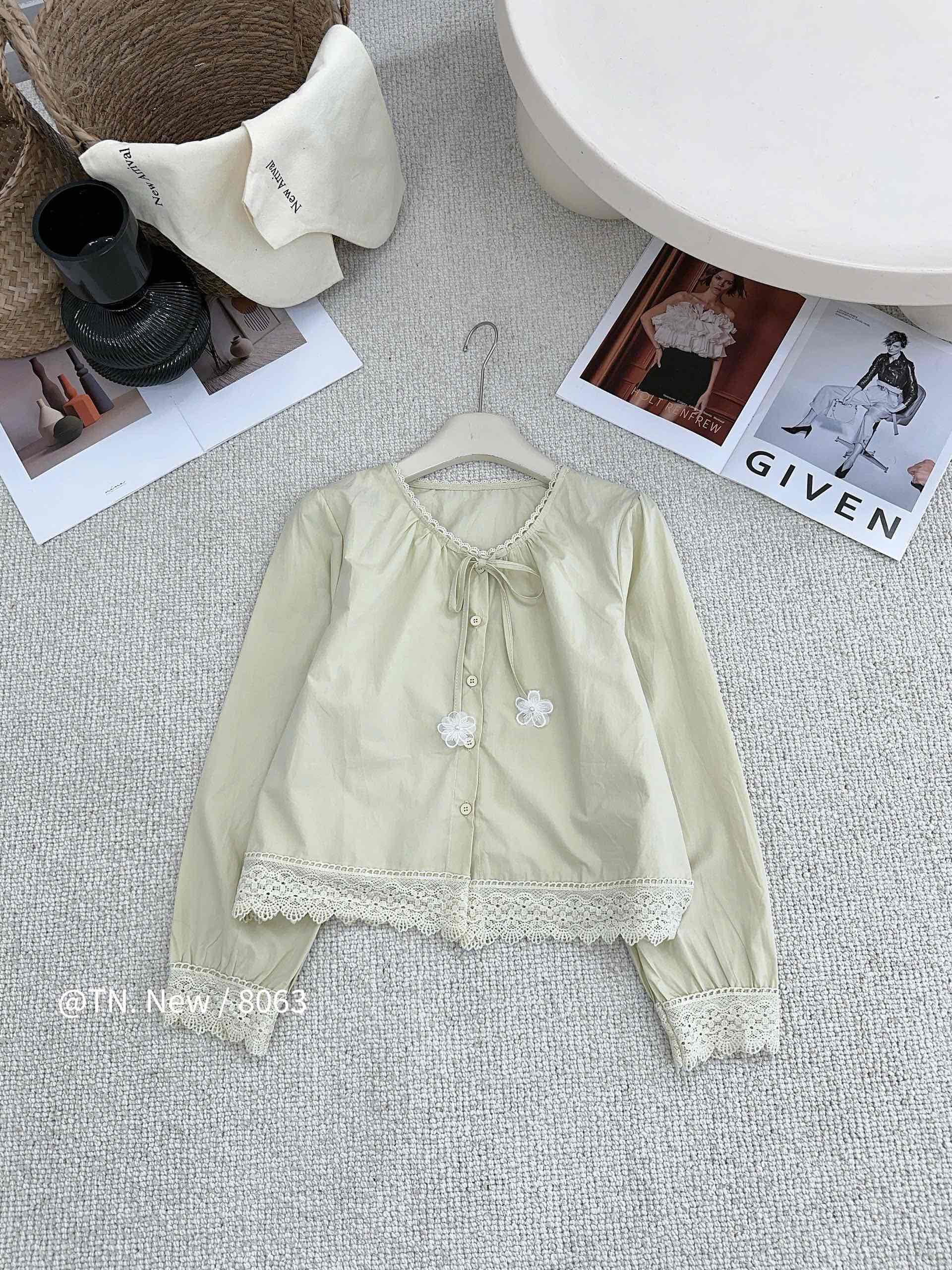 Áo kiểu  thô cổ tròn buộc nơ ren gấu chân áo