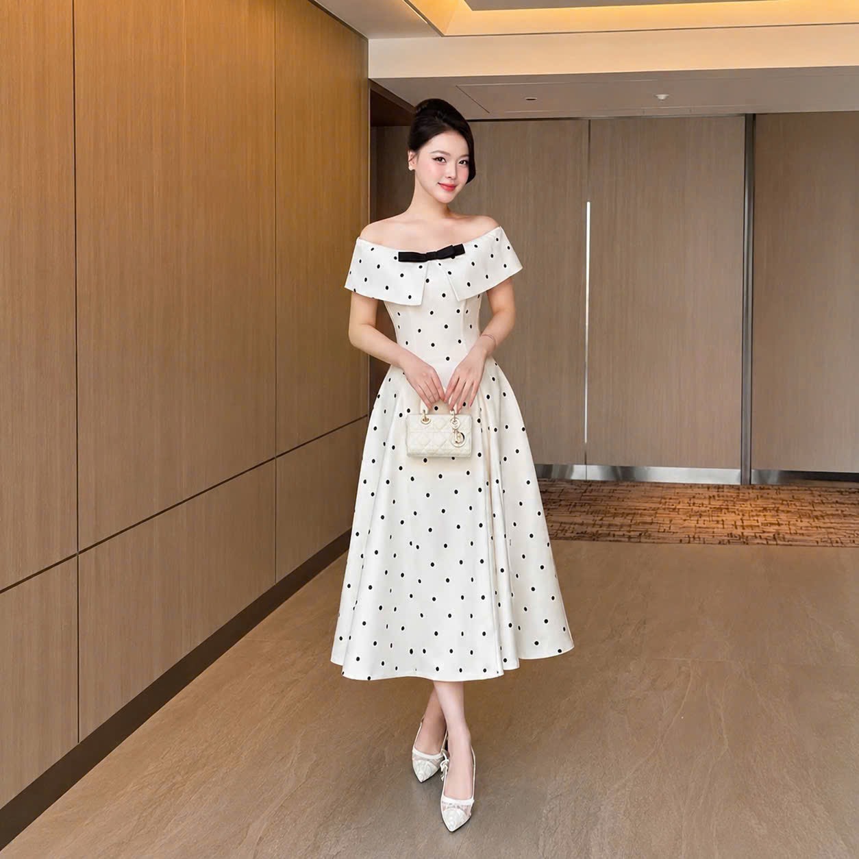 Đầm thiết kế trễ vai chấm bi nơ ngực
