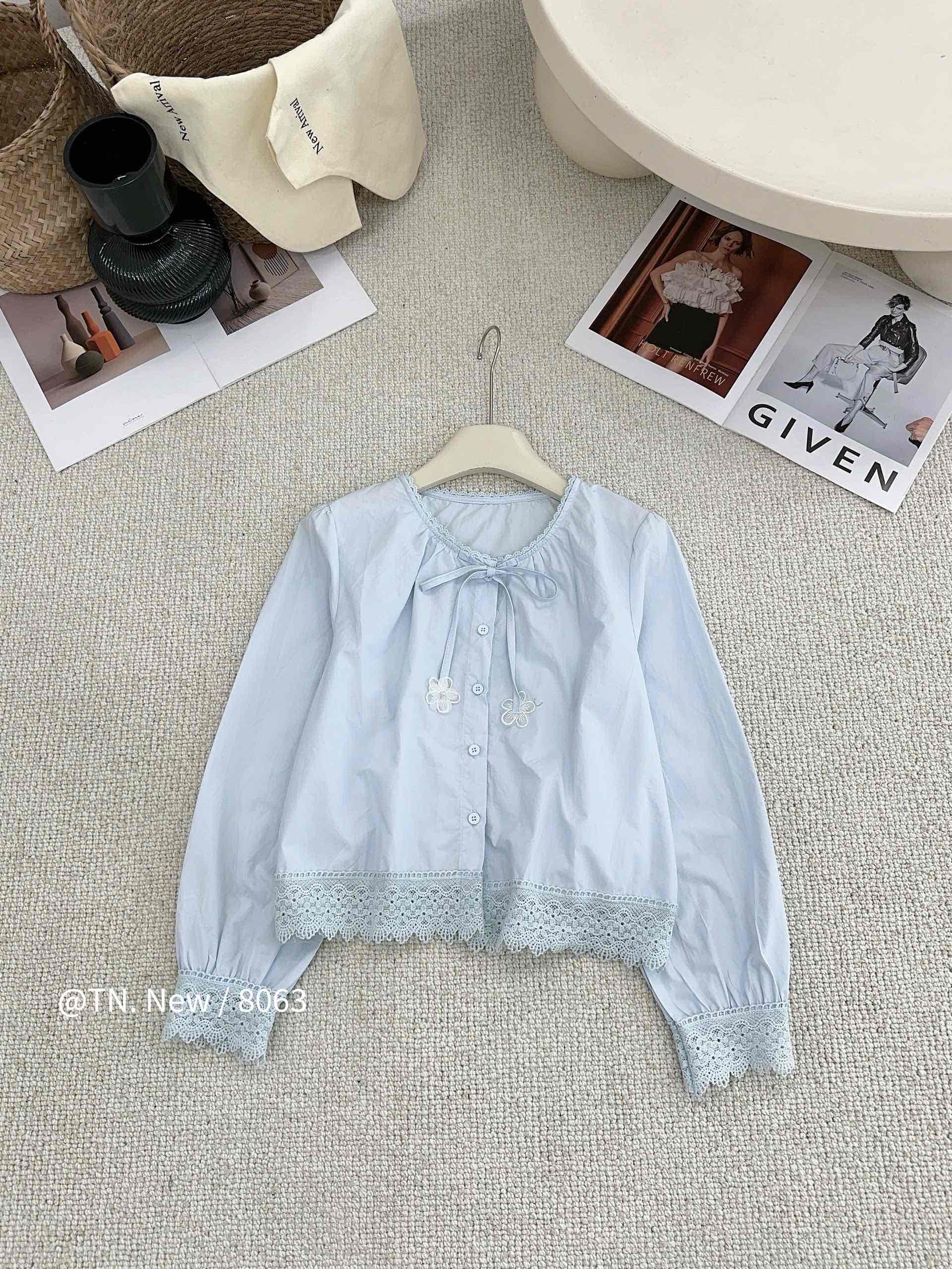 Áo kiểu  thô cổ tròn buộc nơ ren gấu chân áo