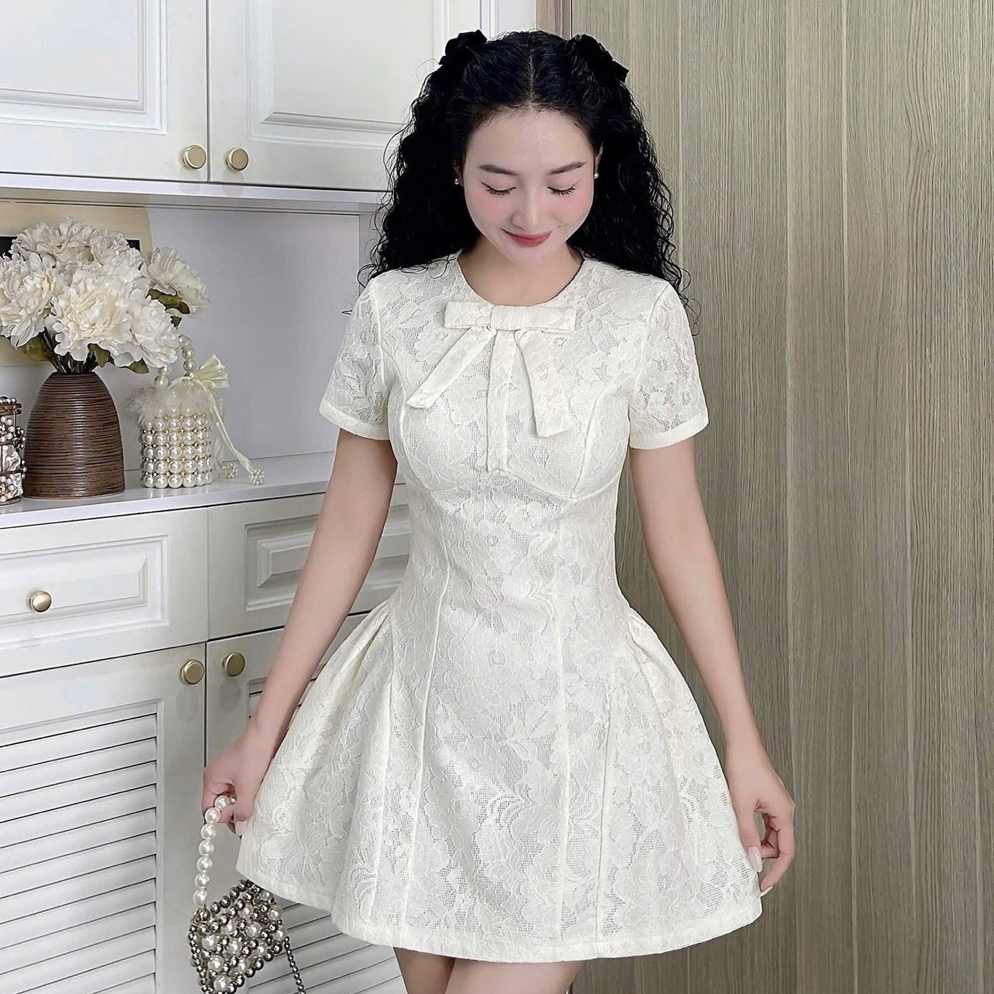 Đầm thiết kế cổ tròn nơ dáng A xoè ngắn