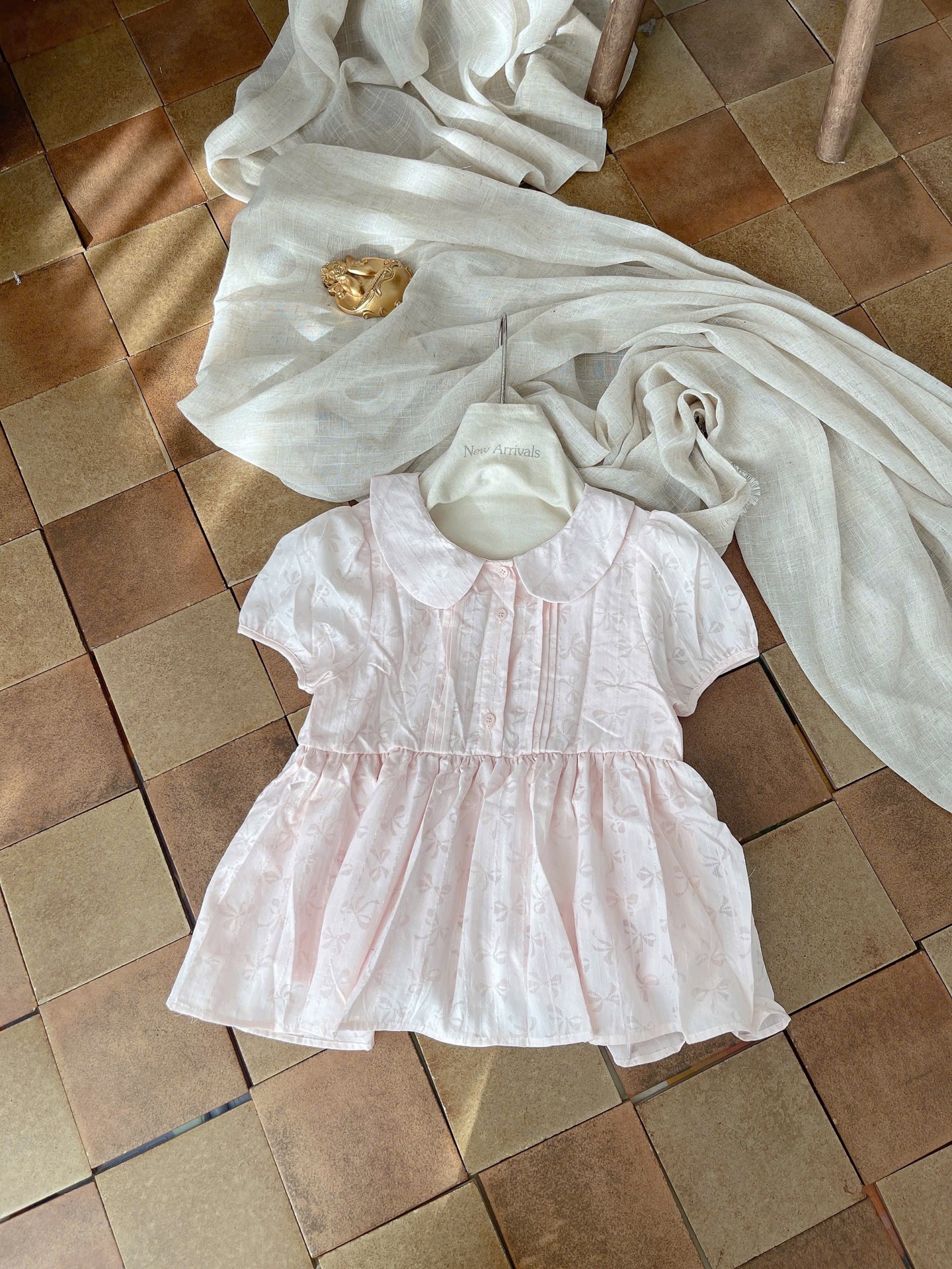 Áo kiểu babydoll nơ nút ngực