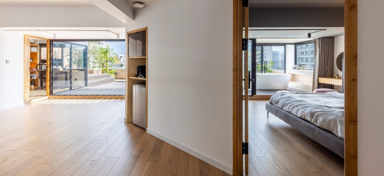 Cải tạo hai căn hộ thành không gian thông tầng 310m² ngập nắng tại Sài Gòn