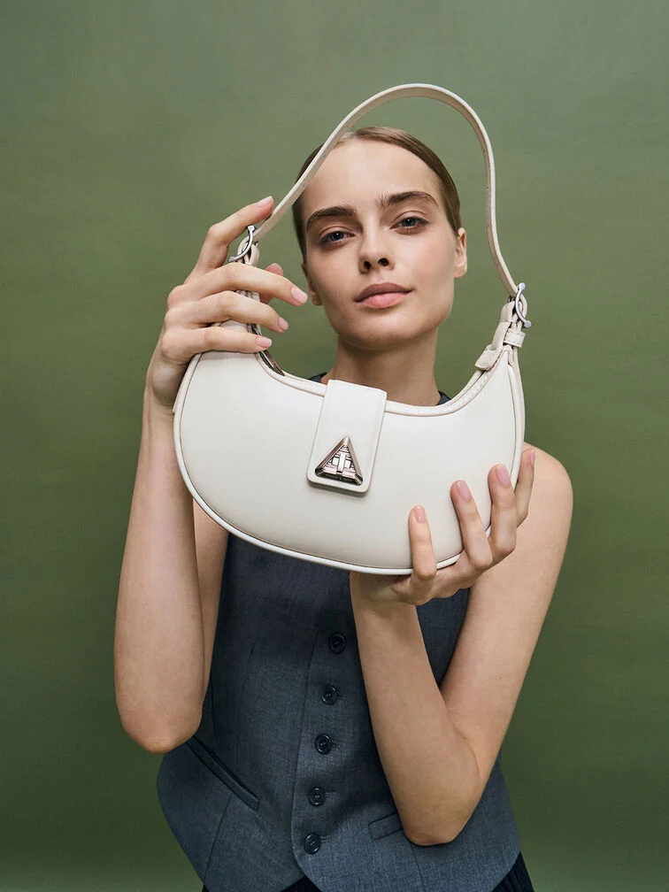 Trice Metallic Accent Belted Curved Shoulder Bag