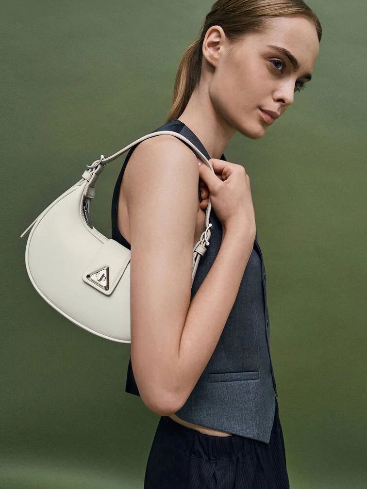 Trice Metallic Accent Belted Curved Shoulder Bag