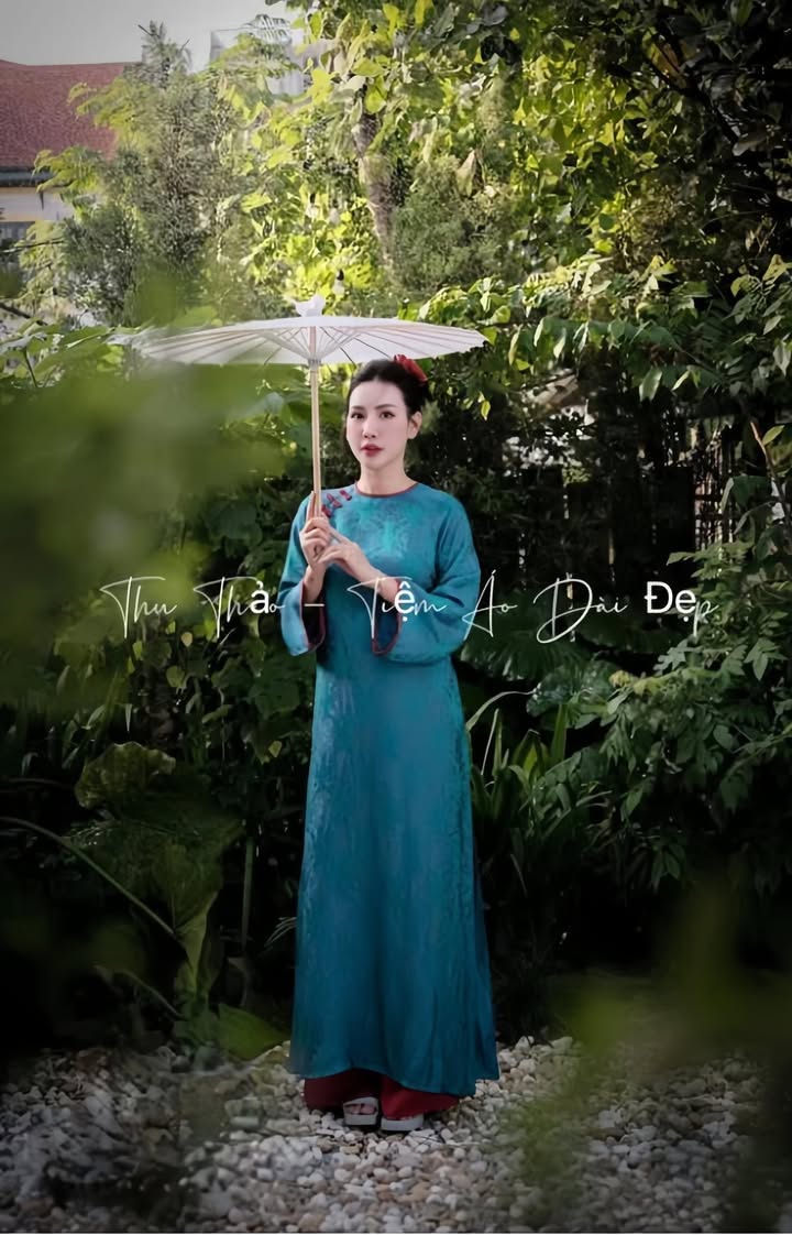 AD lụa thọ xanh viền đỏ đính nơ vai