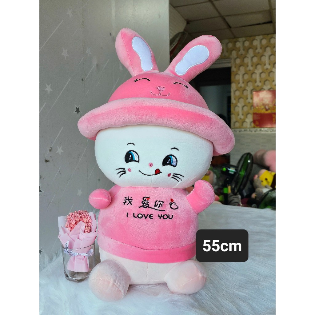 Gấu Bông Mèo Ngồi Mắt Liếc Đội Mũ Thỏ Khổng Lồ Dễ Thương SALOME Thú Bông Mèo Hồng Liếm Mép Ôm Ngủ