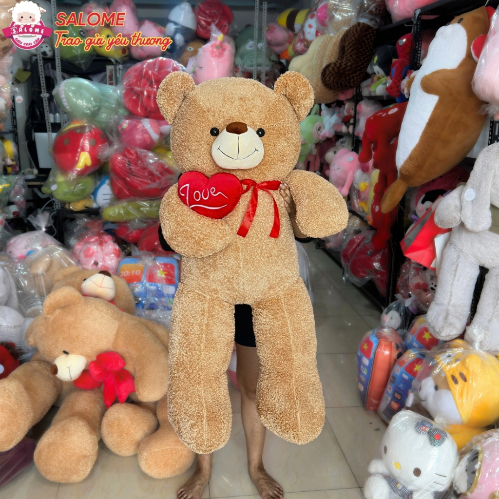 Gấu bông teddy xù  ôm trái tim đỏ một bên