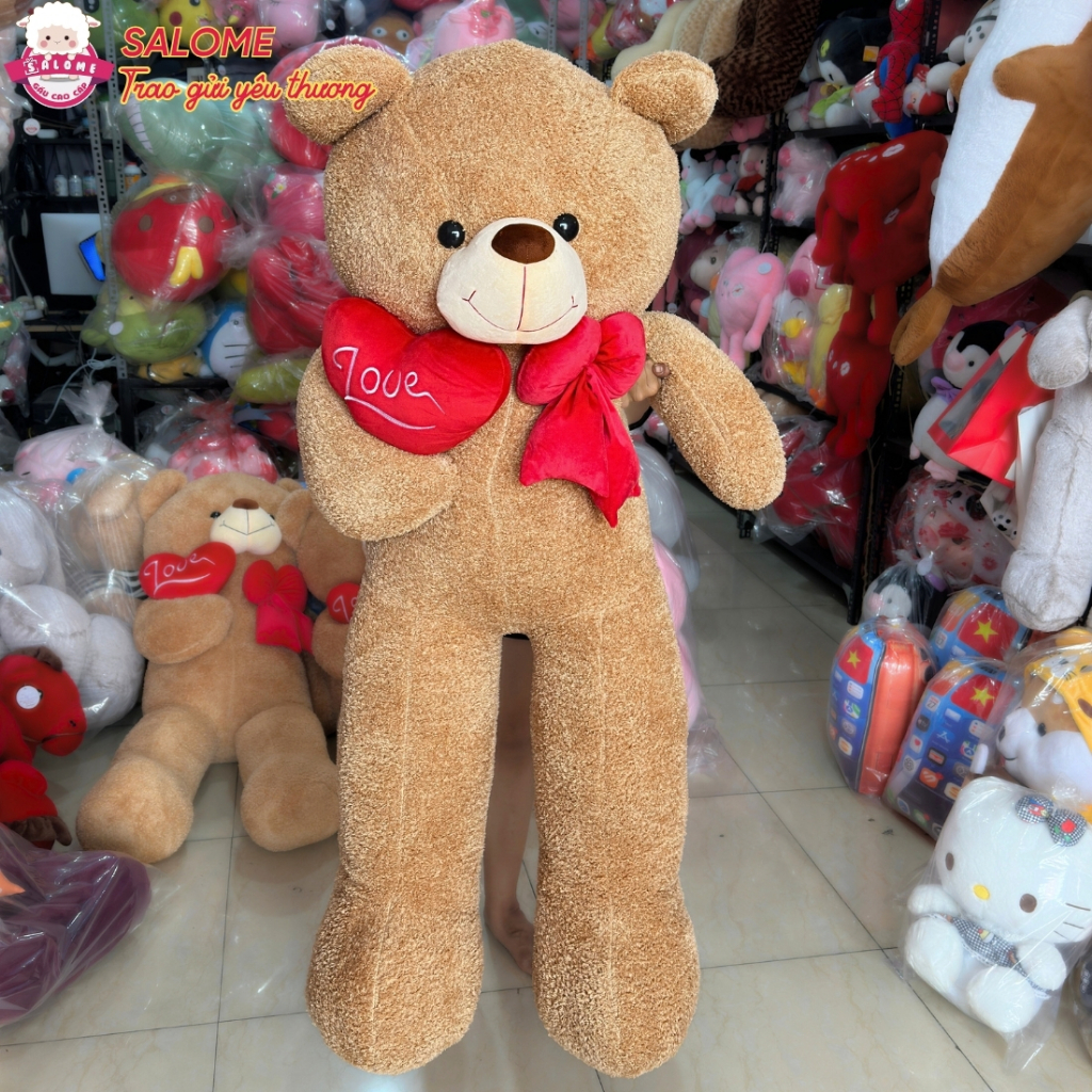 Gấu bông teddy xù  ôm trái tim đỏ một bên