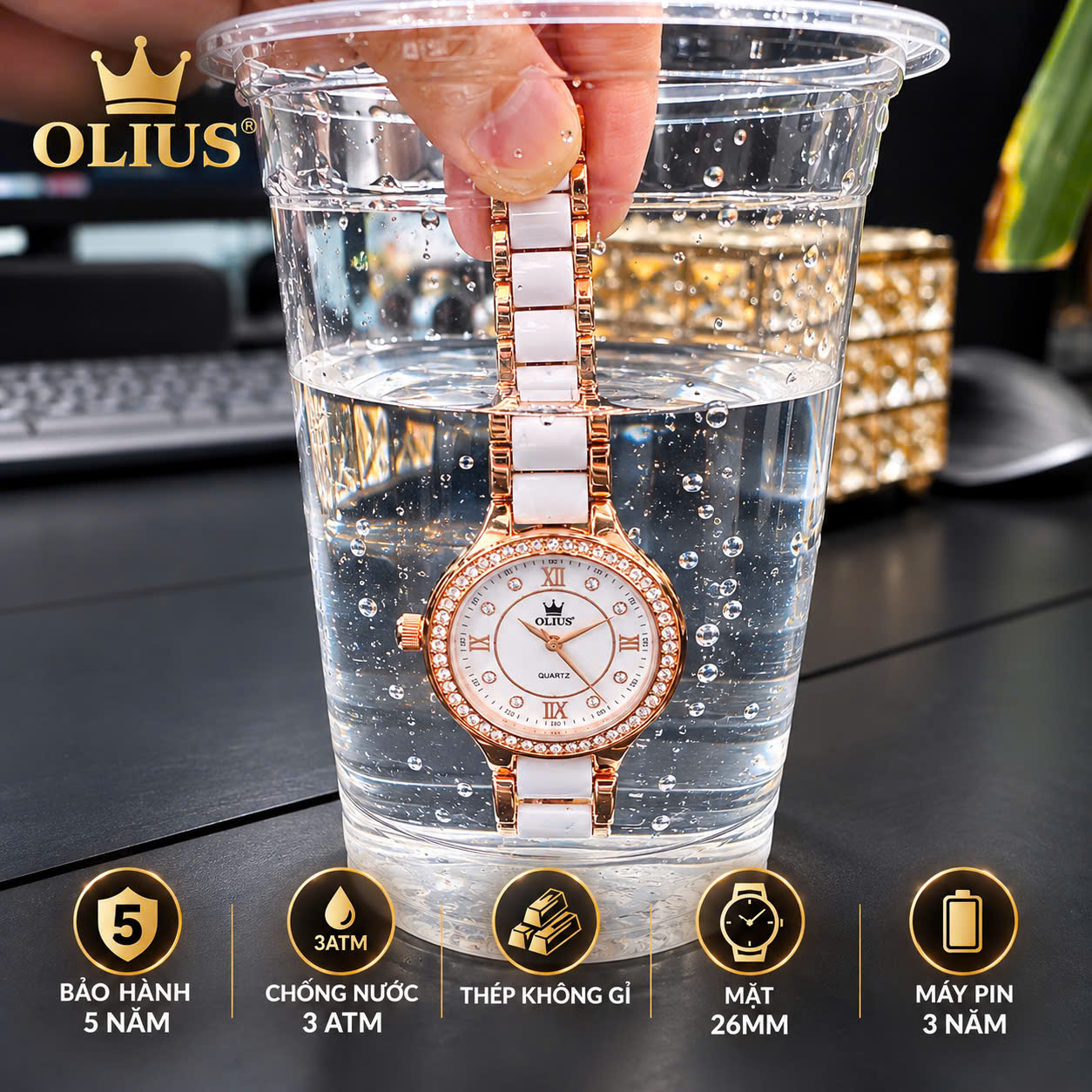 ĐỒNG HỒ NỮ OLIUS 28MM VÀNG HỒNG MẶT TRẮNG – DÂY GỐM SỨ – ĐÍNH ĐÁ PHA LÊ – MÁY QUARTZ