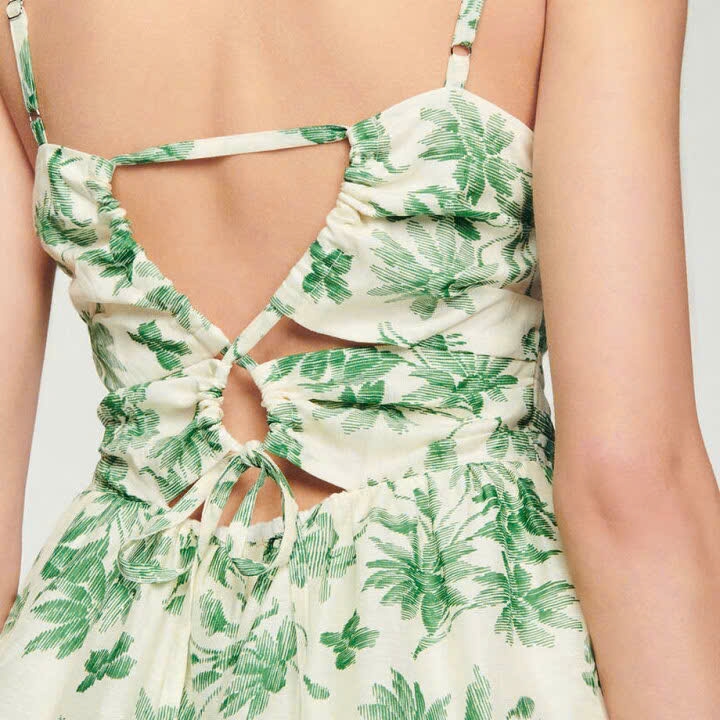 Váy ngắn vải lanh hoạ tiết hoa cắt xoắn