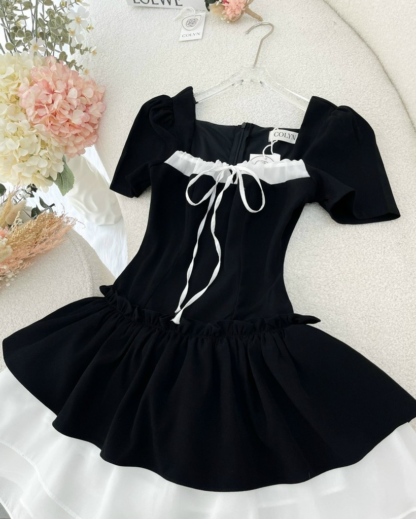 Đầm đen phối tơ cột nơ