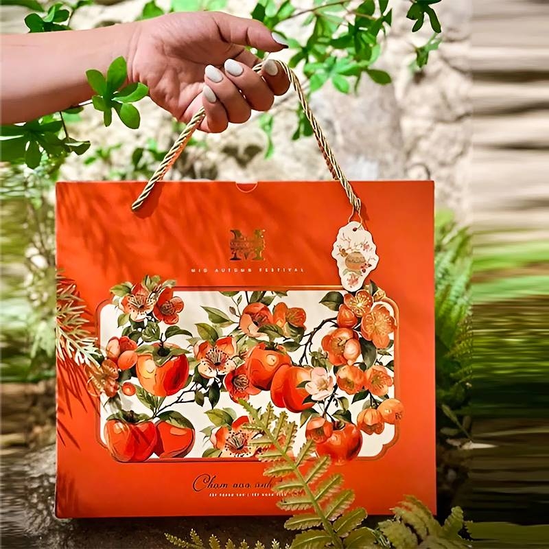 Tay cầm hộp 4 bánh trung thu chắc chắn, màu sắc rất nổi bật