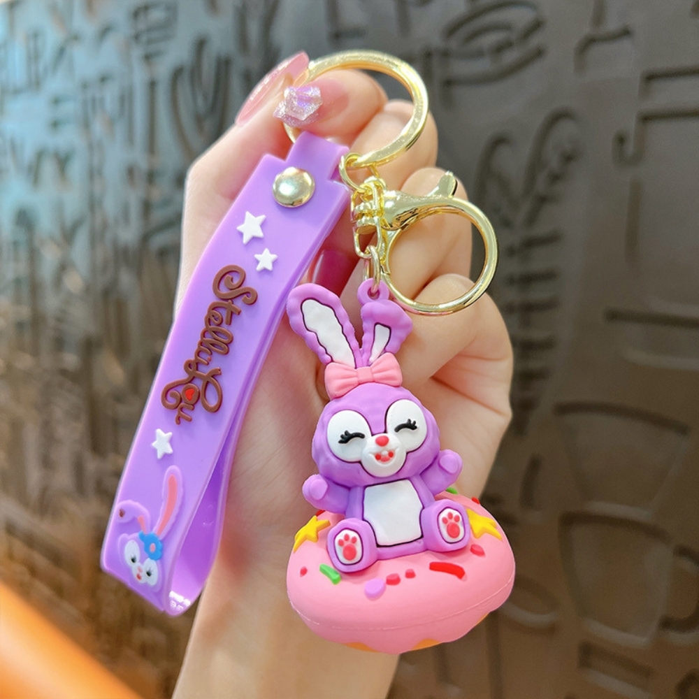 Móc khóa thỏ tím ngồi bánh - Dây móc dài : 11cm - Mô Hình Cao : 7cm - Nặng : 50gram - No Box - SKU: moc153 - (Vat: 88223-7) - K79-T1-S12